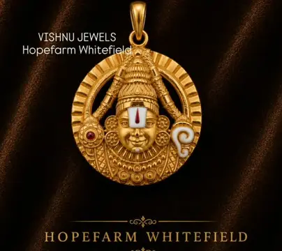 Gold Balaji pendant on dark silk, from their own card