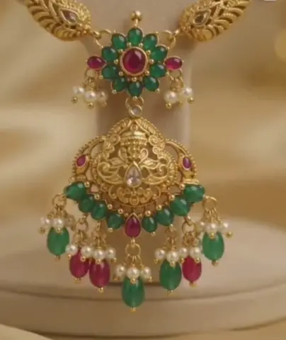 Jhumka with green and ruby stones, pearl drops