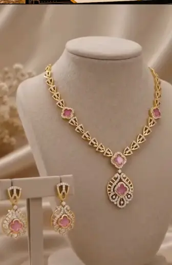 Pink stone diamond necklace and earrings on white busts