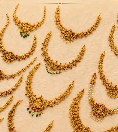 A spread of antique gold necklaces laid flat, guttapusalu and temple work
